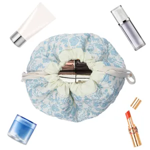 Quilted makeup bag with floral print, drawstring cosmetic pouch, portable travel organizer.
