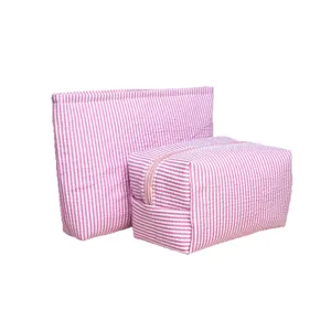 Pink striped cosmetic bag set, portable travel toiletry storage pouch for daily use.