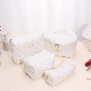 Cute polka dot quilted cosmetic bag set, soft portable large capacity travel makeup pouch.