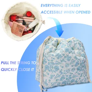Quilted floral cosmetic bag detail displaying spacious open storage and secure drawstring closure.
