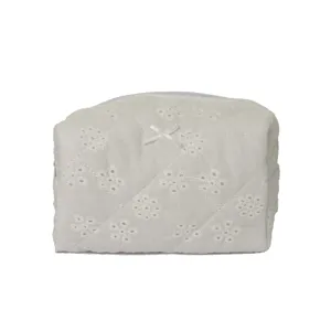 White quilted lace cosmetic bag, cute bow makeup pouch, portable travel toiletry organizer.