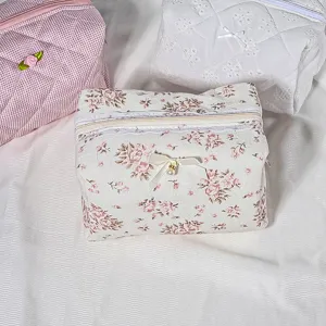 Floral quilted cosmetic bag with cute bow, portable large capacity zip toiletry pouch for women.