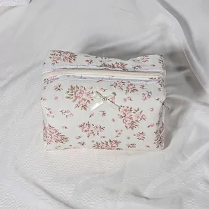 Quilted floral cosmetic pouch detail, vintage lace trim and sweet pearl bow design.