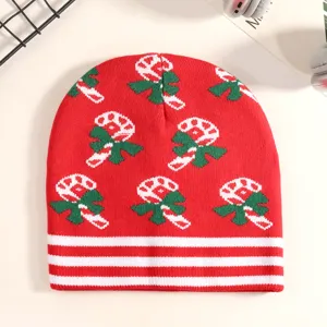 Christmas knit beanie featuring candy cane pattern and white stripes, festive winter detail.