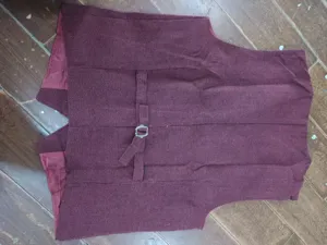 Men's herringbone tweed suit vest back detail showcasing adjustable back strap and hardware.