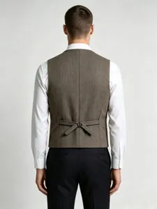 Men's herringbone tweed suit vest back detail showing adjustable strap and metal buckle.