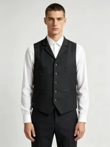 Detail shot of men's suit vest lapel and buttons, professional tailoring and classic style.