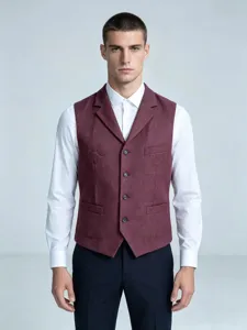 Close up detail of the classic herringbone suit waistcoat worn by a professional model.