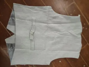 Back detail view of a classic herringbone suit vest, elegant business casual apparel for men.