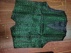 Men's stage performance sequin vest, green wave pattern waistcoat with front button closure.