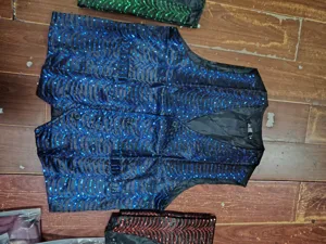 Men's sequin vest for stage performance, blue wavy design, single-breasted waistcoat for party or show.