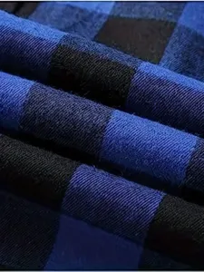 High quality blue and black plaid flannel fabric texture detail for men stylish shirt.