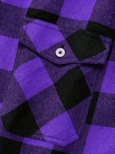 Detailed shot of a purple black plaid flannel men shirt with chest pocket and button.