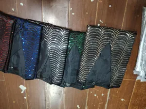 Men sequin vest detail showcasing vibrant multi-color stage performance waistcoat options.
