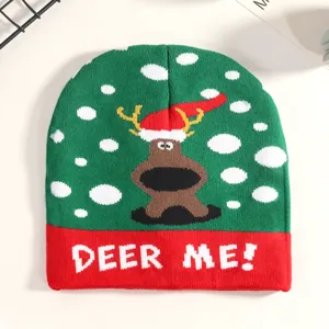 Christmas knitted beanie hat with cute reindeer pattern and winter snow design for festive wear.
