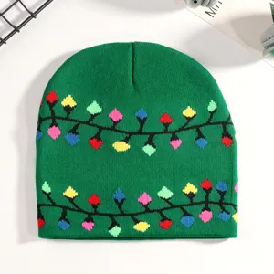 Detail view of green knit beanie featuring colorful Christmas light bulb pattern for winter holiday.