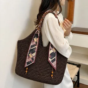 Brown woven straw tote bag for women, large capacity shoulder handbag with chic scarf decor.