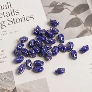 Close-up of dark blue Czech glass double hole ginger beads, 3x7mm DIY loose craft accessories.