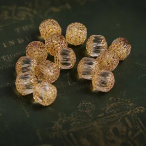 Close-up of translucent faceted vintage beads for DIY handmade jewelry crafts and necklaces.