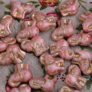Pink elephant glass beads with gold tracing, 20mm DIY handmade jewelry detail shot.