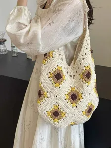 Handmade crochet sunflower shoulder bag, large capacity casual knit tote for beach vacation.