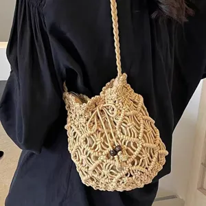 Summer casual handmade macrame woven crossbody bag, women's straw bucket shoulder bag display.