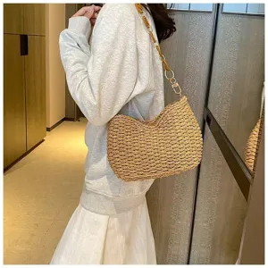 Chic straw woven shoulder bag for women, trendy beach handbag with stylish acrylic chain.
