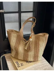 Chic straw woven tote bag for women, large capacity striped shoulder bag for beach vacation.