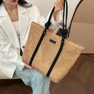 Hollow straw woven bag for women, large capacity tote bag with black handles, beach vacation.