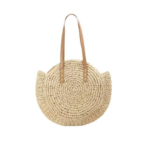 Woven straw shoulder bag for women, round beach tote with leather handles and chic design.