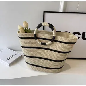 Stylish straw woven tote bag for women, large capacity striped beach bag for casual summer vacation.