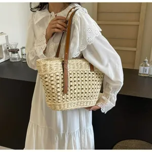 Hollow woven straw tote bag for women, stylish single shoulder casual beach handbag.