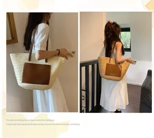 Detailed view of the women's woven straw tote bag with stylish contrast leather pocket.
