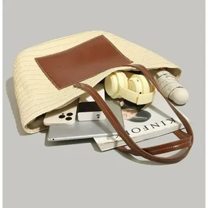 Large capacity straw tote bag for women, stylish woven shoulder bag for summer beach vacation.
