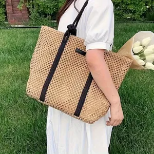 Handmade straw woven tote bag for women, large capacity vacation beach shoulder bag.