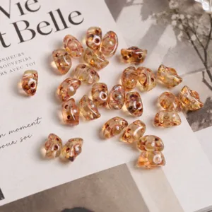 Detailed view of Czech glass butterfly beads double hole DIY jewelry making components.