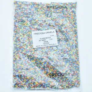 Detailed shot of Preciosa multi-colored glass seed beads in a transparent package.