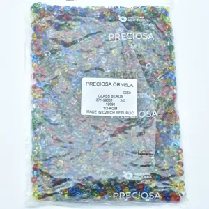 Detailed close-up of Preciosa mixed Czech glass beads in a clear bag, multi-color assortment.