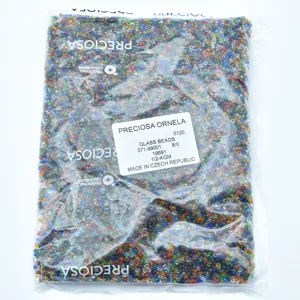 Detailed shot of mixed color Czech glass beads in a transparent package, size 8/0.