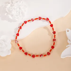 Handcrafted red heart beaded bracelet with gold spacer beads, stylish minimalist jewelry for women.