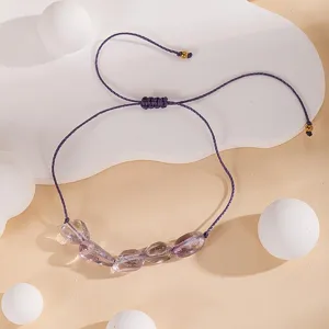 Bracelet cordon tressé violet fait main galet de cristal réglable bijou chic.