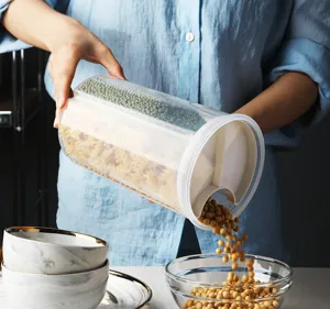 Kitchen multi-compartment food storage jar clear plastic grain container for home use.