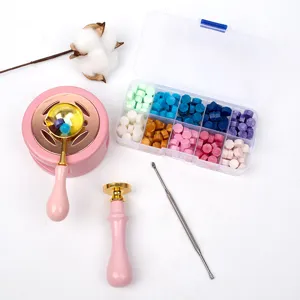 Wax seal stamp kit with colored octagonal sealing wax beads, melting spoon, and furnace stove.