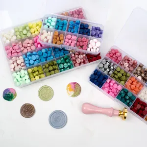 Wax seal beads kit with multi-compartment storage boxes, colorful octagonal sealing wax for crafts.
