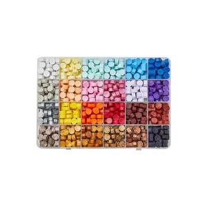 Colorful octagonal sealing wax beads set in a clear compartmentalized storage box.
