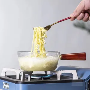 High borosilicate glass saucepan with wooden handle for instant noodles and kitchen cooking.