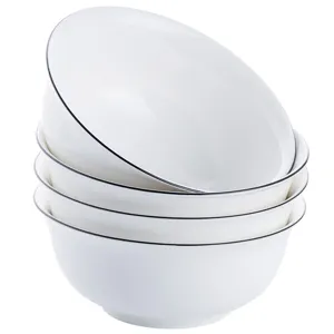 Stapelbares weißes Keramikschalen-Set mit schwarzem Rand ideal für Küche und Restaurant.