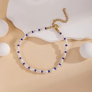 Elegant mixed bead pearl bracelet with blue rice beads and adjustable gold chain detail view