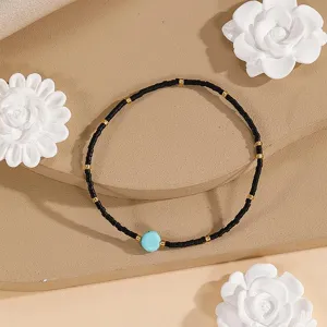 Minimalist woven seed bead bracelet with turquoise stone and metallic gold spacers for women