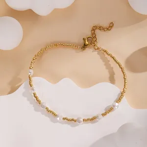 Elegant gold beaded bracelet with white pearls, adjustable chain, delicate design for summer style.